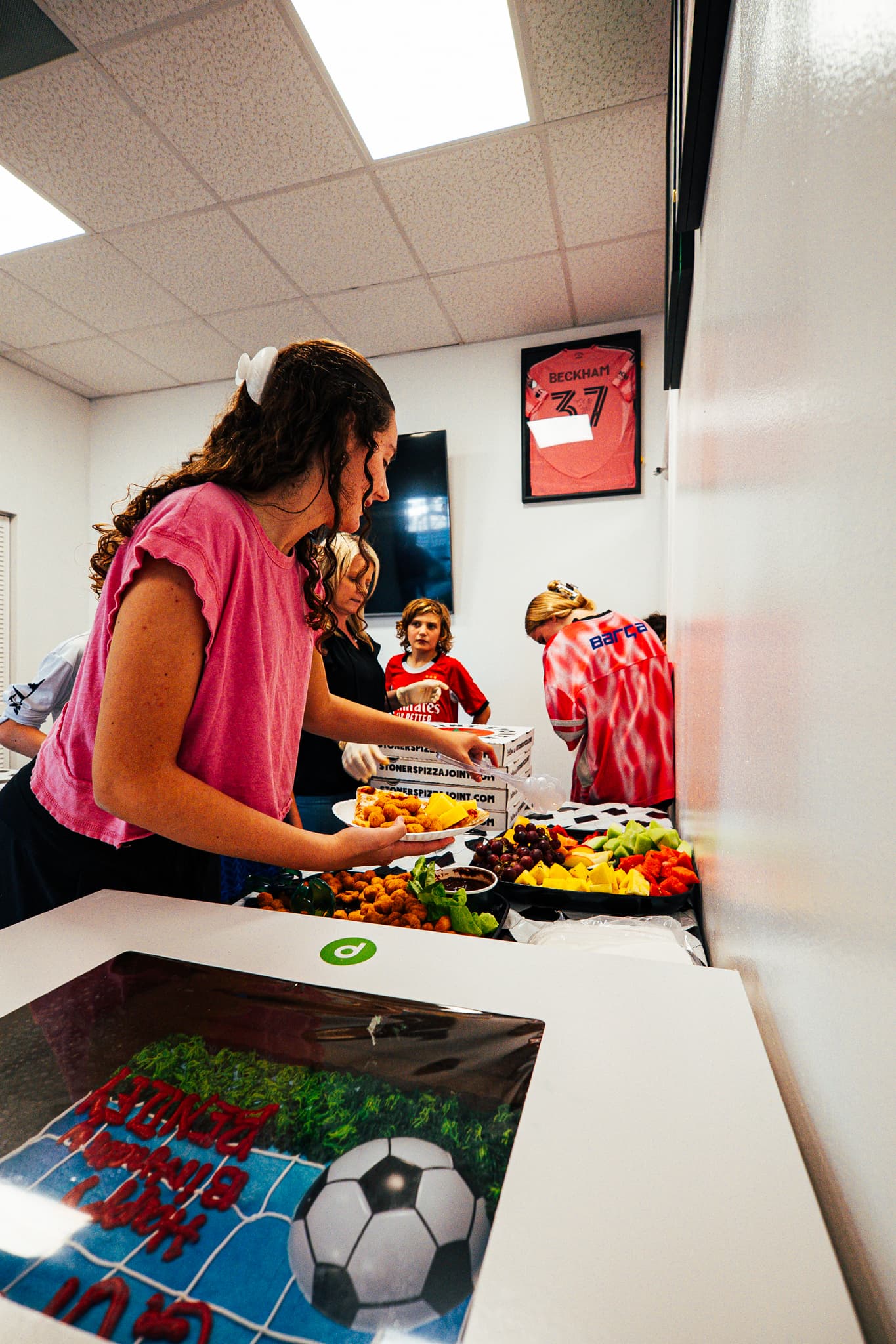 Kids enjoying food at a SoFlo Soccer birthday celebration